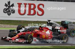 Kimi Raikkonen (FIN) Ferrari F14-T and Lewis Hamilton (GBR) Mercedes AMG F1 W05 battle for position. 20.07.2014. Formula 1 World Championship, Rd 10, German Grand Prix, Hockenheim, Germany, Race Day.