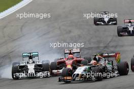 Lewis Hamilton (GBR) Mercedes AMG F1 W05 and Kimi Raikkonen (FIN) Ferrari F14-T battle for position. 20.07.2014. Formula 1 World Championship, Rd 10, German Grand Prix, Hockenheim, Germany, Race Day.