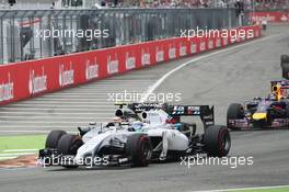 Felipe Massa (BRA) Williams FW36 and Kevin Magnussen (DEN) McLaren MP4-29 collide at the start of the race. 20.07.2014. Formula 1 World Championship, Rd 10, German Grand Prix, Hockenheim, Germany, Race Day.