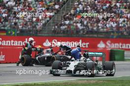 Lewis Hamilton (GBR) Mercedes AMG F1 W05 passes the Sauber C33 of Adrian Sutil (GER), who spun and retired from the race. 20.07.2014. Formula 1 World Championship, Rd 10, German Grand Prix, Hockenheim, Germany, Race Day.