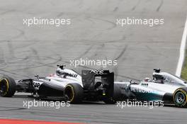 Jenson Button (GBR) McLaren MP4-29 and Lewis Hamilton (GBR) Mercedes AMG F1 W05 make contact as they battle for position. 20.07.2014. Formula 1 World Championship, Rd 10, German Grand Prix, Hockenheim, Germany, Race Day.