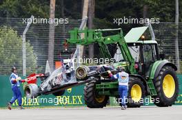 The fire damaged Scuderia Toro Rosso STR9 of Daniil Kvyat (RUS) Scuderia Toro Rosso is removed from the circuit. 20.07.2014. Formula 1 World Championship, Rd 10, German Grand Prix, Hockenheim, Germany, Race Day.