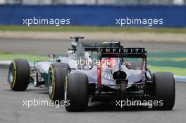 Lewis Hamilton (GBR) Mercedes AMG F1 W05 leads Daniel Ricciardo (AUS) Red Bull Racing RB10. 20.07.2014. Formula 1 World Championship, Rd 10, German Grand Prix, Hockenheim, Germany, Race Day.