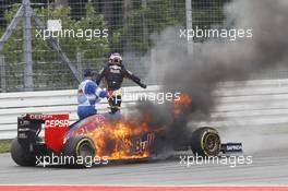 Daniil Kvyat (RUS) Scuderia Toro Rosso STR9 catches fire and retires from the race. 20.07.2014. Formula 1 World Championship, Rd 10, German Grand Prix, Hockenheim, Germany, Race Day.