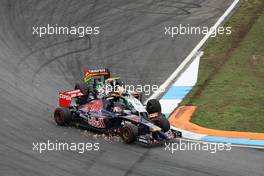 Daniil Kvyat (RUS) Scuderia Toro Rosso STR9 and Sergio Perez (MEX) Sahara Force India F1 VJM07 make contact whilst battling for position. 20.07.2014. Formula 1 World Championship, Rd 10, German Grand Prix, Hockenheim, Germany, Race Day.