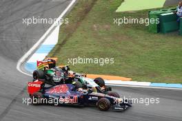 Daniil Kvyat (RUS) Scuderia Toro Rosso STR9 and Sergio Perez (MEX) Sahara Force India F1 VJM07 make contact whilst battling for position. 20.07.2014. Formula 1 World Championship, Rd 10, German Grand Prix, Hockenheim, Germany, Race Day.