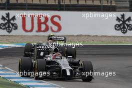 Jenson Button (GBR) McLaren MP4-29 leads team mate Kevin Magnussen (DEN) McLaren MP4-29. 20.07.2014. Formula 1 World Championship, Rd 10, German Grand Prix, Hockenheim, Germany, Race Day.