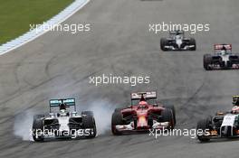 Lewis Hamilton (GBR) Mercedes AMG F1 W05 and Kimi Raikkonen (FIN) Ferrari F14-T battle for position. 20.07.2014. Formula 1 World Championship, Rd 10, German Grand Prix, Hockenheim, Germany, Race Day.