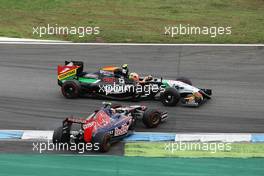 Daniil Kvyat (RUS) Scuderia Toro Rosso STR9 and Sergio Perez (MEX) Sahara Force India F1 VJM07 make contact whilst battling for position. 20.07.2014. Formula 1 World Championship, Rd 10, German Grand Prix, Hockenheim, Germany, Race Day.