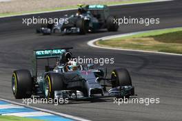 Lewis Hamilton (GBR) Mercedes AMG F1 W05 leads team mate Nico Rosberg (GER) Mercedes AMG F1 W05. 19.07.2014. Formula 1 World Championship, Rd 10, German Grand Prix, Hockenheim, Germany, Qualifying Day.