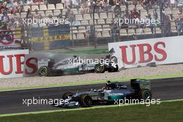 Pole sitter Nico Rosberg (GER) Mercedes AMG F1 W05 passes his team mate Lewis Hamilton (GBR) Mercedes AMG F1 W05, who crashed out of the first session of qualifying. 19.07.2014. Formula 1 World Championship, Rd 10, German Grand Prix, Hockenheim, Germany, Qualifying Day.