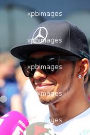 Lewis Hamilton (GBR) Mercedes AMG F1 with the media. 19.07.2014. Formula 1 World Championship, Rd 10, German Grand Prix, Hockenheim, Germany, Qualifying Day.