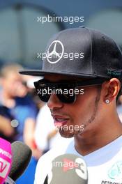 Lewis Hamilton (GBR) Mercedes AMG F1 with the media. 19.07.2014. Formula 1 World Championship, Rd 10, German Grand Prix, Hockenheim, Germany, Qualifying Day.