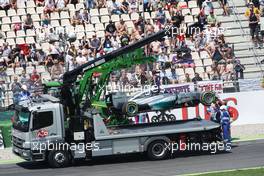 The Mercedes AMG F1 W05 of Lewis Hamilton (GBR) Mercedes AMG F1 is craned away after he crashed out of the first session of qualifying. 19.07.2014. Formula 1 World Championship, Rd 10, German Grand Prix, Hockenheim, Germany, Qualifying Day.