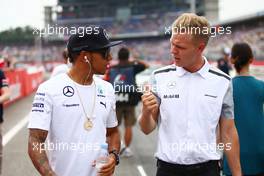 (L to R): Lewis Hamilton (GBR) Mercedes AMG F1 with Kevin Magnussen (DEN) McLaren on the drivers parade. 20.07.2014. Formula 1 World Championship, Rd 10, German Grand Prix, Hockenheim, Germany, Race Day.