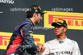 (L to R): Race winner Daniel Ricciardo (AUS) Red Bull Racing celebrates on the podium with third placed Lewis Hamilton (GBR) Mercedes AMG F1. 27.07.2014. Formula 1 World Championship, Rd 11, Hungarian Grand Prix, Budapest, Hungary, Race Day.