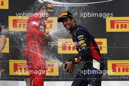 1st place Daniel Ricciardo (AUS) Red Bull Racing RB10, 2nd place Fernando Alonso (ESP) Ferrari. 27.07.2014. Formula 1 World Championship, Rd 11, Hungarian Grand Prix, Budapest, Hungary, Race Day.
