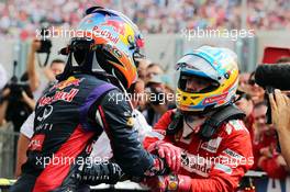 (L to R): Race winner Daniel Ricciardo (AUS) Red Bull Racing celebrates with second placed Fernando Alonso (ESP) Ferrari in parc ferme. 27.07.2014. Formula 1 World Championship, Rd 11, Hungarian Grand Prix, Budapest, Hungary, Race Day.