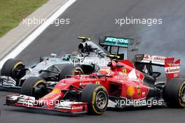 Nico Rosberg (GER), Mercedes AMG F1 Team anf Kimi Raikkonen (FIN), Scuderia Ferrari  27.07.2014. Formula 1 World Championship, Rd 11, Hungarian Grand Prix, Budapest, Hungary, Race Day.