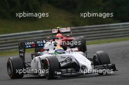 Felipe Massa (BRA) Williams FW36 leads Kimi Raikkonen (FIN) Ferrari F14-T. 27.07.2014. Formula 1 World Championship, Rd 11, Hungarian Grand Prix, Budapest, Hungary, Race Day.