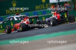 Kimi Raikkonen (FIN) Ferrari F14-T and Sebastian Vettel (GER) Red Bull Racing. 27.07.2014. Formula 1 World Championship, Rd 11, Hungarian Grand Prix, Budapest, Hungary, Race Day.