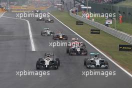 Kevin Magnussen (DEN), McLaren F1 and Nico Rosberg (GER), Mercedes AMG F1 Team  27.07.2014. Formula 1 World Championship, Rd 11, Hungarian Grand Prix, Budapest, Hungary, Race Day.
