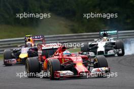 Fernando Alonso (ESP) Ferrari F14-T leads Daniel Ricciardo (AUS) Red Bull Racing RB10 and Lewis Hamilton (GBR) Mercedes AMG F1. 27.07.2014. Formula 1 World Championship, Rd 11, Hungarian Grand Prix, Budapest, Hungary, Race Day.
