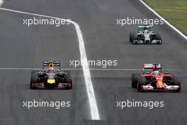 Daniel Ricciardo (AUS), Red Bull Racing overtakes Fernando Alonso (ESP), Scuderia Ferrari Sahara Force India Formula One Team the lead 27.07.2014. Formula 1 World Championship, Rd 11, Hungarian Grand Prix, Budapest, Hungary, Race Day.