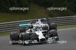 Nico Rosberg (GER) Mercedes AMG F1 leads Felipe Massa (BRA) Williams FW36. 27.07.2014. Formula 1 World Championship, Rd 11, Hungarian Grand Prix, Budapest, Hungary, Race Day.