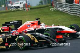 Romain Grosjean (FRA) Lotus F1 E22 and Jules Bianchi (FRA) Marussia F1 Team MR03 battle for position. 27.07.2014. Formula 1 World Championship, Rd 11, Hungarian Grand Prix, Budapest, Hungary, Race Day.