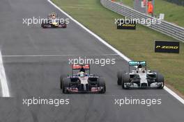 Jean-Eric Vergne (FRA), Scuderia Toro Rosso  and Lewis Hamilton (GBR), Mercedes AMG F1 Team  27.07.2014. Formula 1 World Championship, Rd 11, Hungarian Grand Prix, Budapest, Hungary, Race Day.