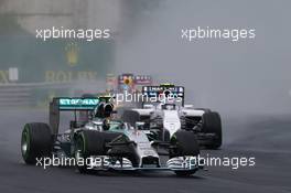 Nico Rosberg (GER) Mercedes AMG F1 W05 leads at the start of the race. 27.07.2014. Formula 1 World Championship, Rd 11, Hungarian Grand Prix, Budapest, Hungary, Race Day.
