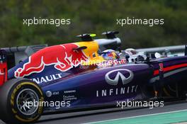 Daniel Ricciardo (AUS) Red Bull Racing RB10 and Lewis Hamilton (GBR) Mercedes AMG F1 W05. 27.07.2014. Formula 1 World Championship, Rd 11, Hungarian Grand Prix, Budapest, Hungary, Race Day.