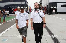 (L to R): Lewis Hamilton (GBR) Mercedes AMG F1 with Bradley Lord (GBR) Mercedes AMG F1 Communications Manager. 26.07.2014. Formula 1 World Championship, Rd 11, Hungarian Grand Prix, Budapest, Hungary, Qualifying Day.