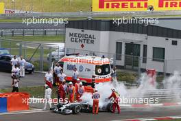 Lewis Hamilton (GBR) Mercedes AMG F1 W05 stops in the pitlane during qualifying after suffering a fire. 26.07.2014. Formula 1 World Championship, Rd 11, Hungarian Grand Prix, Budapest, Hungary, Qualifying Day.