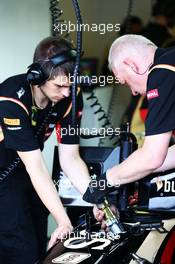 Lotus F1 E22 worked on by mechanics. 26.07.2014. Formula 1 World Championship, Rd 11, Hungarian Grand Prix, Budapest, Hungary, Qualifying Day.