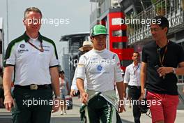 (L to R): Tom Webb (GBR) Caterham F1 Team Head of Communications with Kamui Kobayashi (JPN) Caterham. 26.07.2014. Formula 1 World Championship, Rd 11, Hungarian Grand Prix, Budapest, Hungary, Qualifying Day.