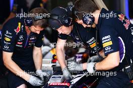 Red Bull Racing RB10 worked on by mechanics. 26.07.2014. Formula 1 World Championship, Rd 11, Hungarian Grand Prix, Budapest, Hungary, Qualifying Day.