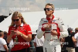 Max Chilton (GBR) Marussia F1 Team with Laura Booth (GBR) Marussia F1 Team. 26.07.2014. Formula 1 World Championship, Rd 11, Hungarian Grand Prix, Budapest, Hungary, Qualifying Day.