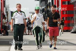 (L to R): Tom Webb (GBR) Caterham F1 Team Head of Communications with Kamui Kobayashi (JPN) Caterham. 26.07.2014. Formula 1 World Championship, Rd 11, Hungarian Grand Prix, Budapest, Hungary, Qualifying Day.