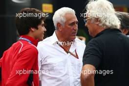 (L to R): Lance Stroll (CDN) with father Lawrence Stroll (CDN) Mont Tremblant Race Circuit Owner; and Flavio Briatore (ITA). 05.09.2014. Formula 1 World Championship, Rd 13, Italian Grand Prix, Monza, Italy, Practice Day.