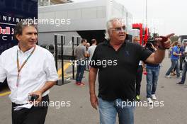 (L to R): Pasquale Lattuneddu (ITA) of the FOM with Flavio Briatore (ITA). 05.09.2014. Formula 1 World Championship, Rd 13, Italian Grand Prix, Monza, Italy, Practice Day.