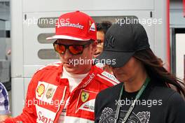 Kimi Raikkonen (FIN) Ferrari with his girlfriend Minttu Virtanen (FIN). 05.09.2014. Formula 1 World Championship, Rd 13, Italian Grand Prix, Monza, Italy, Practice Day.
