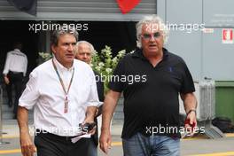 (L to R): Pasquale Lattuneddu (ITA) of the FOM with Flavio Briatore (ITA). 05.09.2014. Formula 1 World Championship, Rd 13, Italian Grand Prix, Monza, Italy, Practice Day.