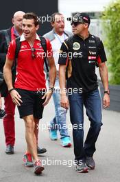 (L to R): Jules Bianchi (FRA) Marussia F1 Team with Pastor Maldonado (VEN) Lotus F1 Team. 05.09.2014. Formula 1 World Championship, Rd 13, Italian Grand Prix, Monza, Italy, Practice Day.