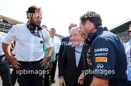 (L to R): Matteo Bonciani (ITA) FIA Media Delegate with Jean Todt (FRA) FIA President and Christian Horner (GBR) Red Bull Racing Team Principal on the grid. 07.09.2014. Formula 1 World Championship, Rd 13, Italian Grand Prix, Monza, Italy, Race Day.