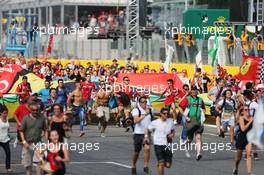 Fans invade the circuit after the end of the race. 07.09.2014. Formula 1 World Championship, Rd 13, Italian Grand Prix, Monza, Italy, Race Day.