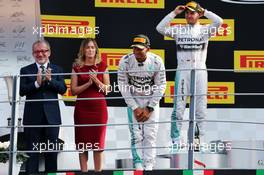 Race winner Lewis Hamilton (GBR) Mercedes AMG F1 celebrates on the podium. 07.09.2014. Formula 1 World Championship, Rd 13, Italian Grand Prix, Monza, Italy, Race Day.