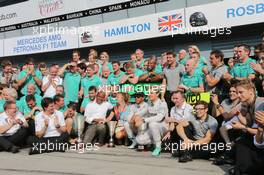 Race winner Lewis Hamilton (GBR) Mercedes AMG F1 celebrates with his step mother Linda Hamilton, father Anthony Hamilton (GBR), team mate Nico Rosberg (GER) Mercedes AMG F1, and the team. 07.09.2014. Formula 1 World Championship, Rd 13, Italian Grand Prix, Monza, Italy, Race Day.