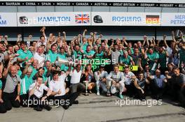 Race winner Lewis Hamilton (GBR) Mercedes AMG F1 celebrates with his step mother Linda Hamilton, father Anthony Hamilton (GBR), team mate Nico Rosberg (GER) Mercedes AMG F1, and the team.  07.09.2014. Formula 1 World Championship, Rd 13, Italian Grand Prix, Monza, Italy, Race Day.